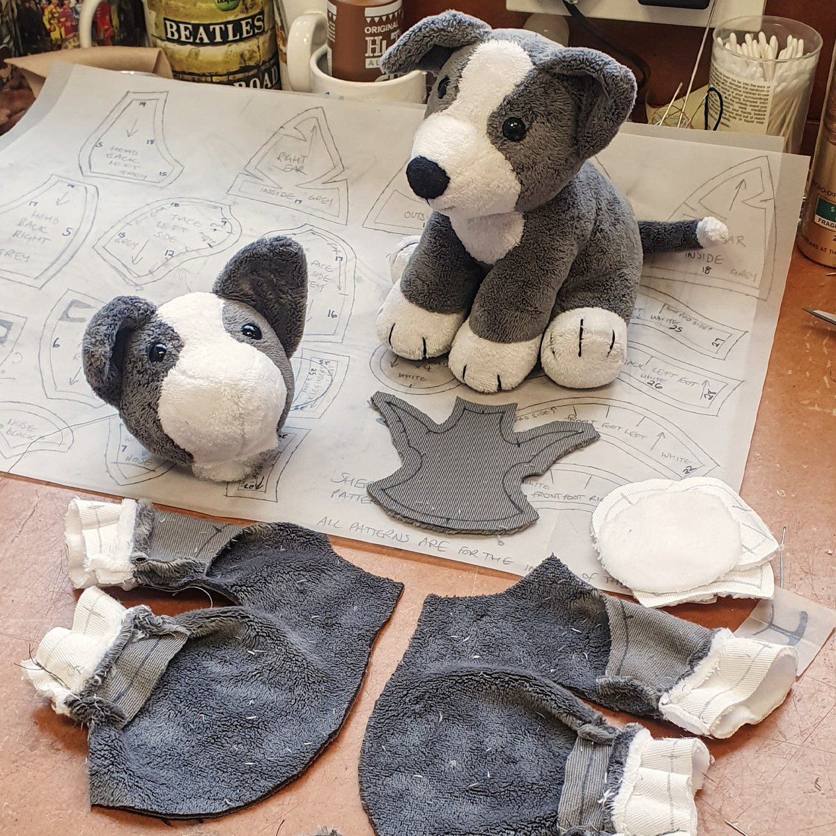 Showing the fabric construction of a Sheppy sheepdog soft toy