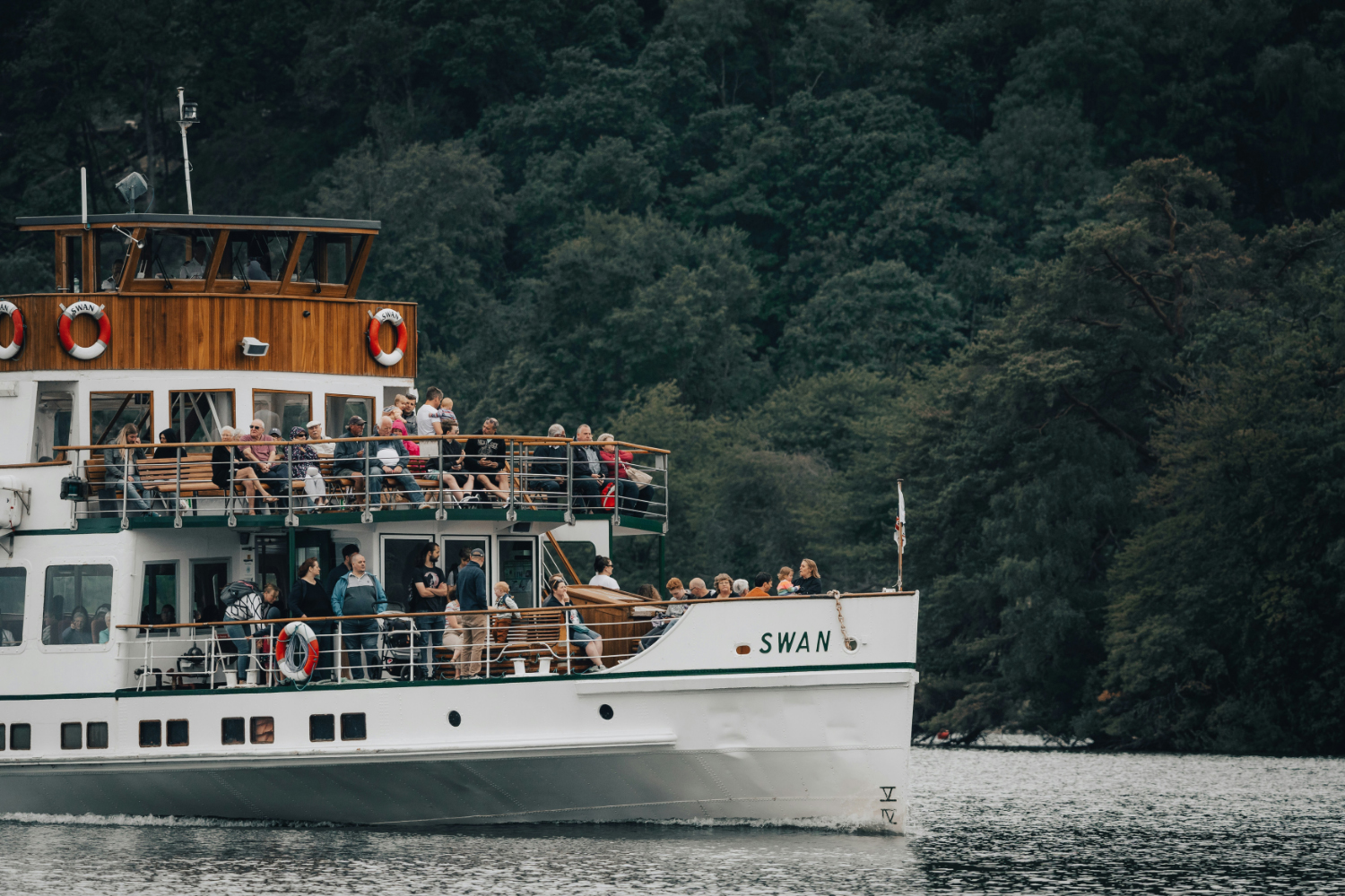 Rain in the Lake District: a large boat filled with passengers on Lake Windermere