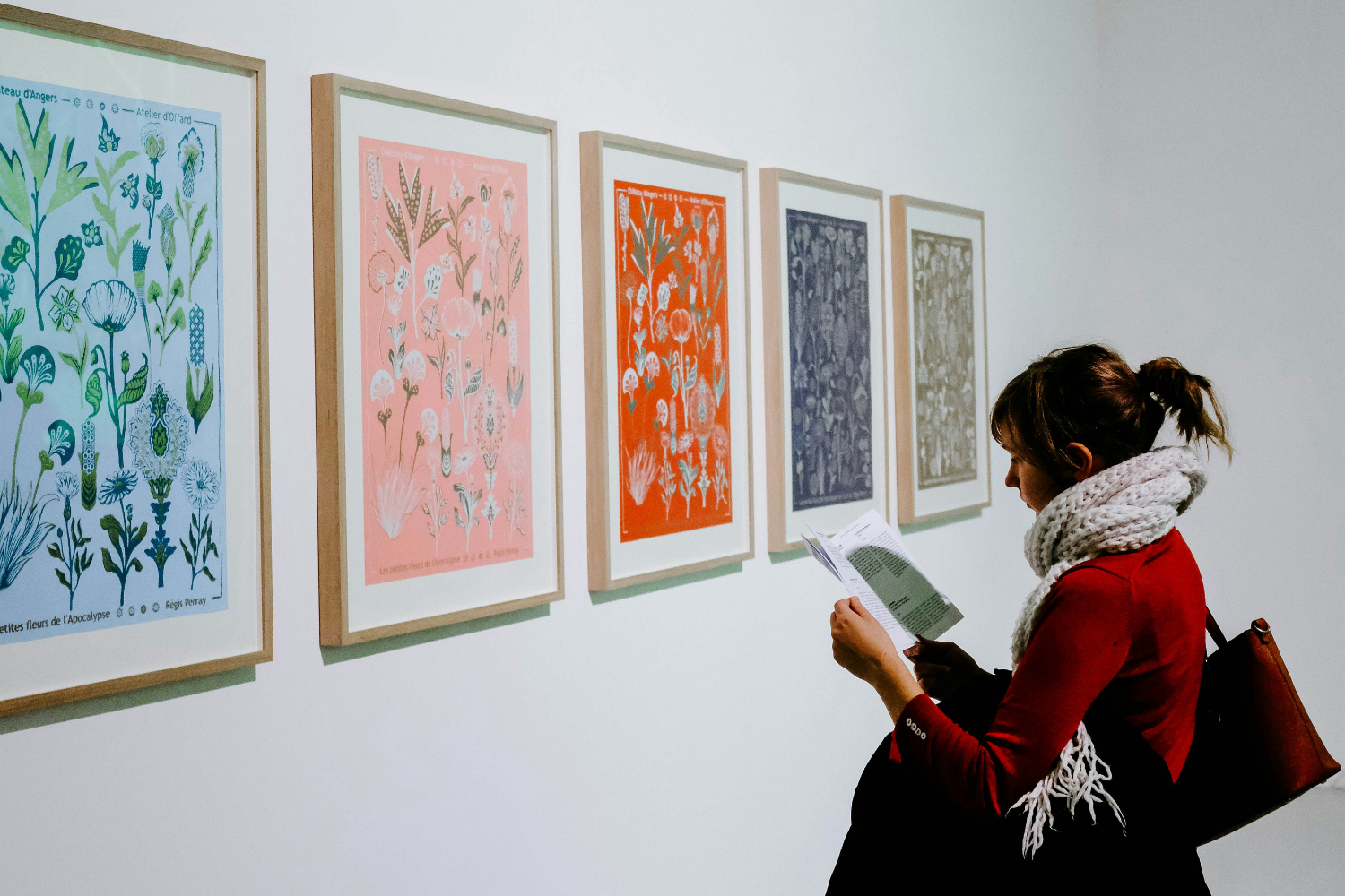 Rain in the Lake District: A woman looking at art work in a gallery