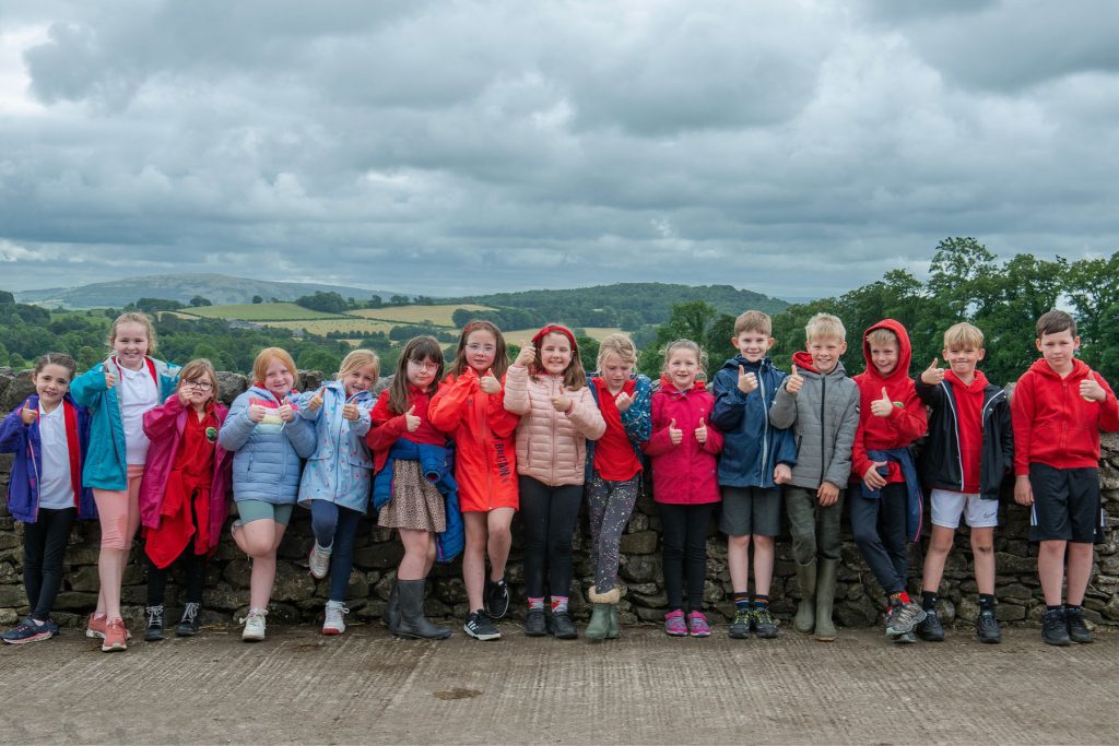 Group of primary school children visiting a Lake District farm